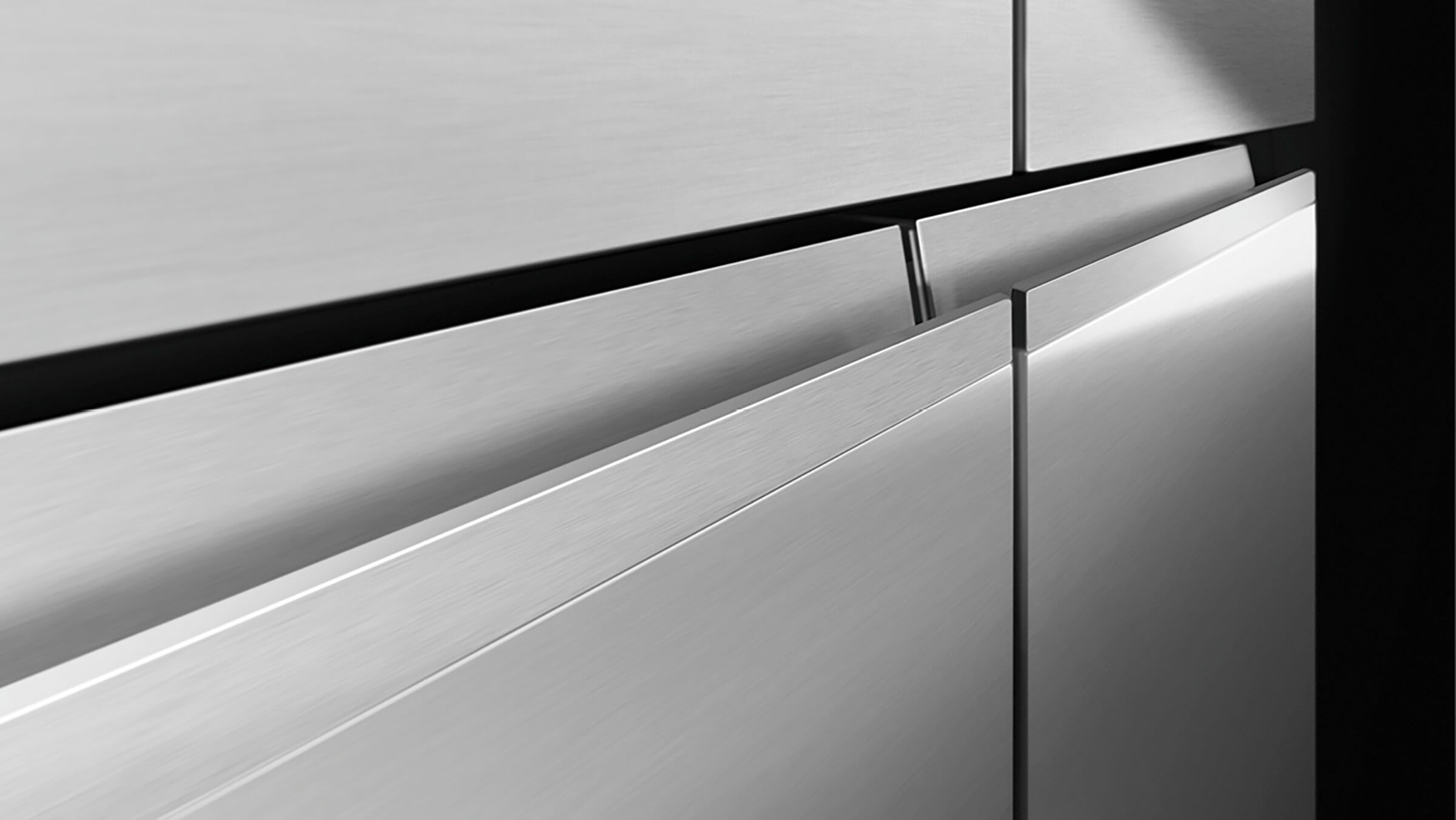 A contemporary freestanding Quad Door refrigerator in a modern kitchen setting