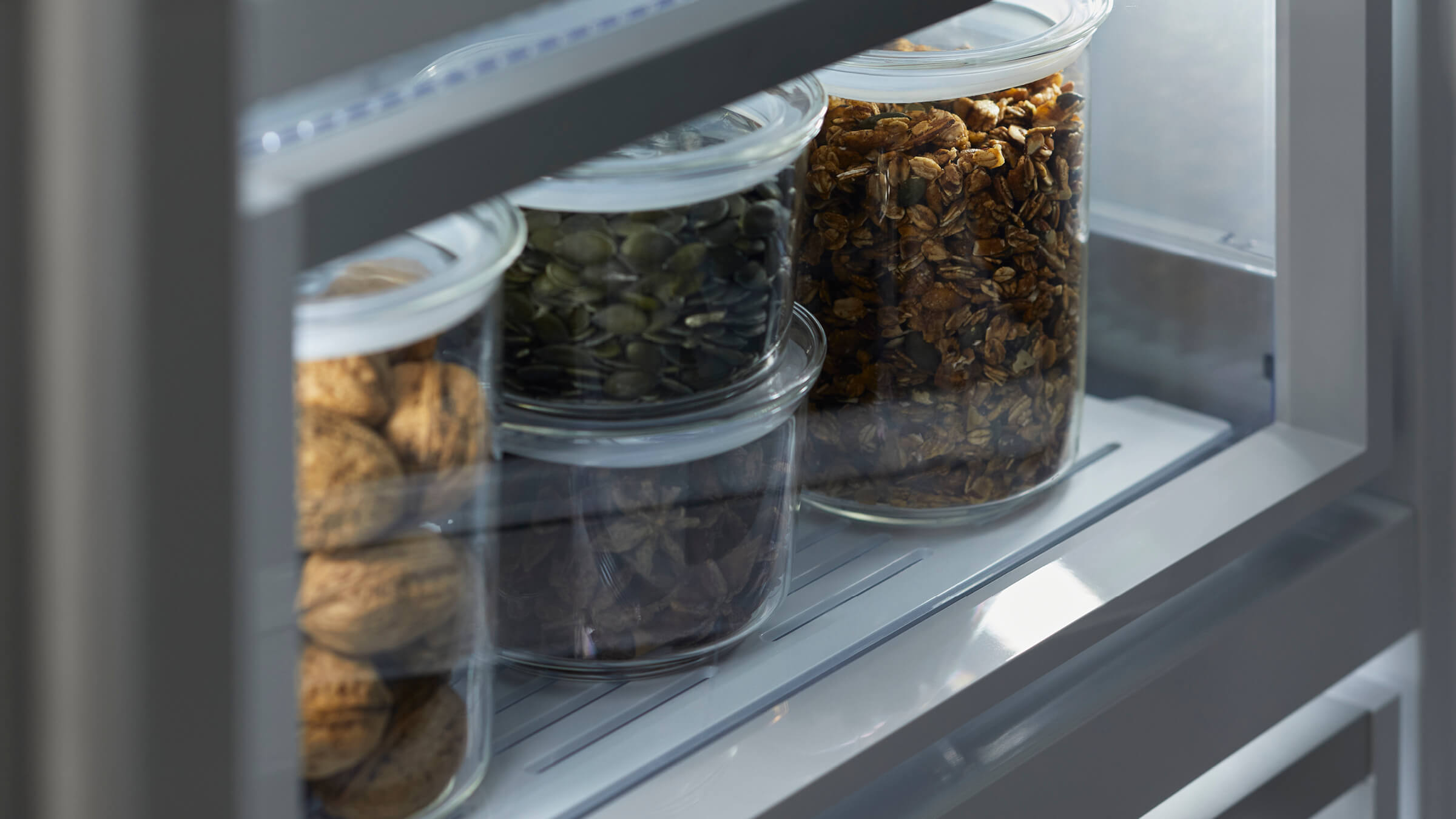 Robust door shelves and storage bins in a vertical refrigerator